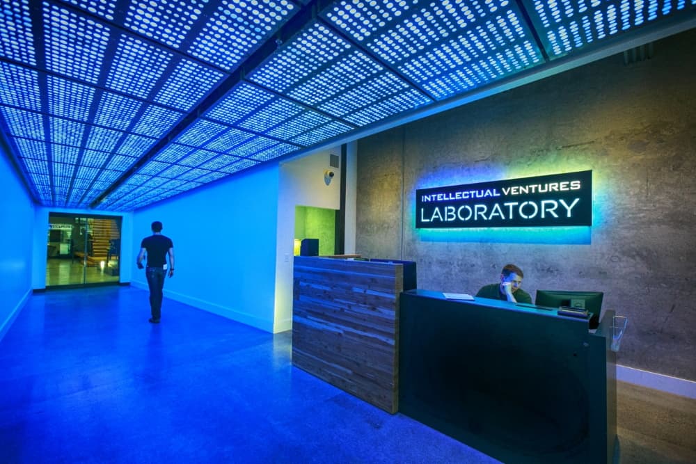 Innovation laboratory reception lit by a programmable blue LED ceiling, with lighting and power installed by H&M Electric